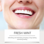 Close-up of a bright smiling mouth above a label that reads 'FRESH MINT' with a short descriptive line beneath on a pale background.