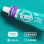 Close-up angled view of a Tom's of Maine toothpaste tube on teal background with gluten-free, vegan, halal and kosher icons.