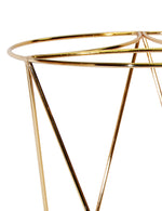Close-up detail of the top ring and triangular supports of a gold metal plant stand