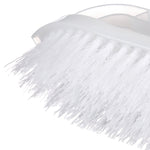 Close-up macro view of dense white synthetic bristles and brush base of a plastic scrub brush
