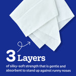 Close-up of layered white tissues on a blue background with text highlighting 3 layers of silky-soft strength