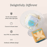 Cocofloss product and box styled on a glass dish with icons and text highlighting coconut-infused, refillable design