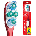 Close-up of a red Colgate 360° toothbrush head showing polishing cups and varied bristle clusters on white background