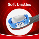 Colgate 360 toothbrush head showing soft blue and white bristles with a dab of toothpaste on a red circular graphic