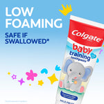 Close-up of Colgate baby training toothpaste tube with elephant illustration and 'low foaming safe if swallowed' text on blue background