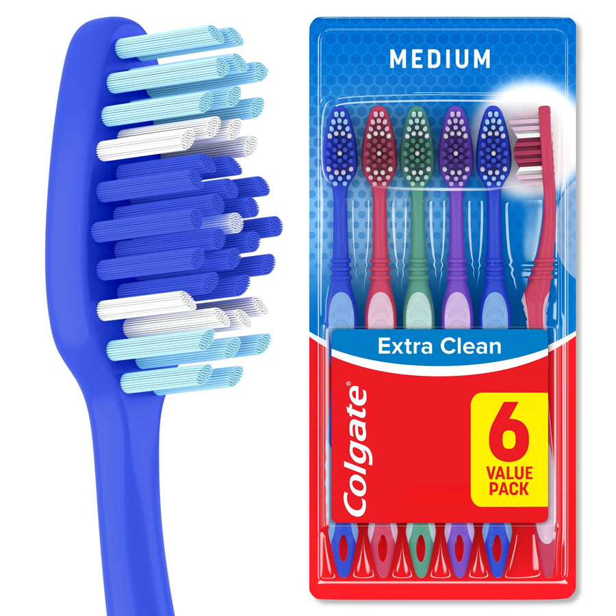 Close-up of a blue Colgate toothbrush head with multi-level blue and white bristles
