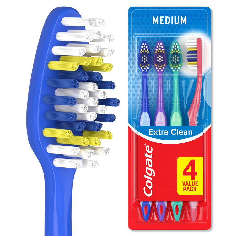 Close-up of a blue toothbrush head with multi-colored circular bristles beside Colgate 4-pack blister card