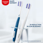 Two Colgate Gum Expert manual toothbrushes, one blue and one white, shown upright with logo and 3x reduction callout