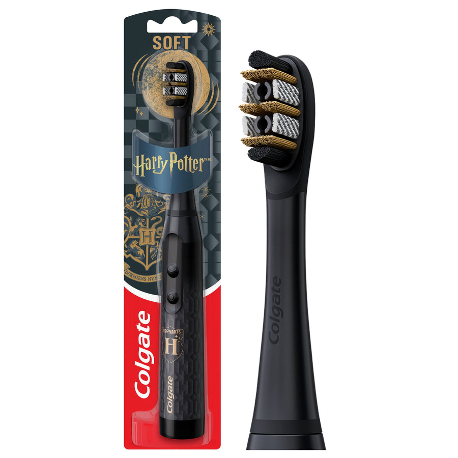 Black Colgate Harry Potter themed battery-powered electric toothbrush in retail blister pack with gold crest accents.