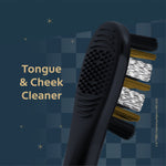 Detail view of a black toothbrush showing a textured tongue and cheek cleaner alongside angled bristles on a dark patterned background.