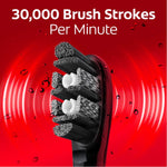 Colgate Optic White toothbrush head angled forward over a red background with text about brush strokes per minute