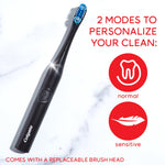 Angled black Colgate toothbrush on a light marble background with icons and text noting two modes: normal and sensitive