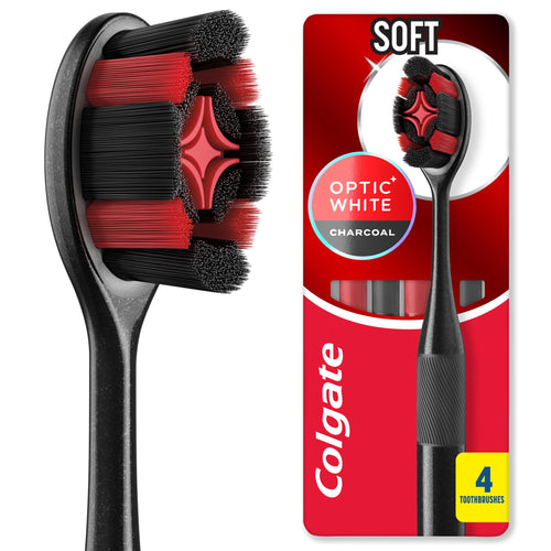 Close-up of a Colgate Optic White charcoal toothbrush head with black and red bristles beside its branded red blister pack.