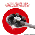 Detail close-up of Colgate Optic White Pro Series toothbrush head showing multi-height bristles with product claim text