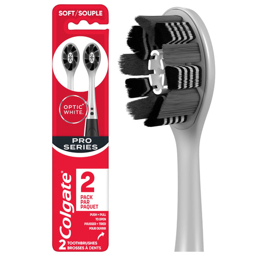 Close-up product shot of a Colgate Optic White Pro Series toothbrush head and packaged two-pack sleeve on white background
