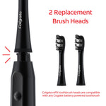 Two black Colgate Optic White replacement toothbrush heads next to a battery toothbrush handle on white background