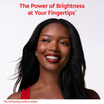 Smiling woman with bright teeth on white background used as a Colgate Optic White promotional lifestyle image