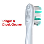 Rear view of a Colgate brush head showing a textured tongue and cheek cleaner on the back and teal-and-white bristles