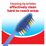 Angled view of a blue toothbrush showing cleaning tip bristles designed to reach hard-to-reach areas with Colgate design