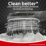 Colgate toothbrush head with vibrating motion effects and water splashes illustrating sonic cleaning action