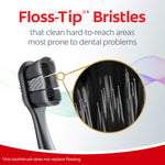 Colgate Total toothbrush head with magnified inset showing floss-tip bristles and a caption about cleaning hard-to-reach areas.