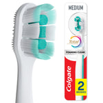 Close-up of a Colgate Total Active Prevention Foaming Clean toothbrush head with teal center pads and white bristles