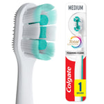 Close-up of a Colgate Total toothbrush head and partial packaged handle, showing dense turquoise and white bristles