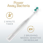 White Colgate Total battery-powered toothbrush angled on a white background with icons for a 2-minute timer and two brushing modes