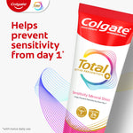 Angled Colgate Total toothpaste tube with colorful wave graphic and text claim about preventing sensitivity from day one