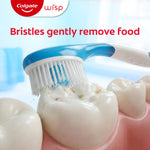 Close macro image of a Colgate Wisp brush gently scrubbing food particles from a molar, with text 'Bristles gently remove food'.