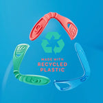 Three colorful tongue cleaners arranged around a recycling symbol with the message “made with recycled plastic” on a blue background.