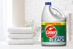 Comet Ultra bleach jug styled in a bright bathroom scene next to folded white towels