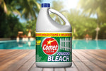 Comet Ultra Outdoor Bleach jug on a wooden deck with blurred pool and palm background
