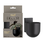 Command Décor black metal wall planter shown next to its retail packaging with removable insert visible