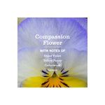 Close-up floral graphic of a pansy with text overlay listing Compassion Flower scent notes including violet, pansy, cedarwood and lemon