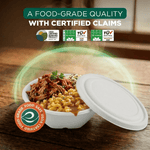 White compostable bowl with lid next to a bowl of food on a wood surface with certification icons and food-grade claim