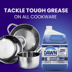 Shiny stainless cookware arranged beside a Dawn Professional heavy duty jug on a purple background