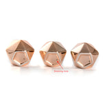 Three copper faceted pots shown from the bottom with a red annotation arrow labeling a draining hole on the center pot