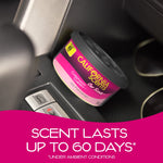 California Scents Coronado Cherry air freshener can placed in a car cup holder with overlay text stating scent lasts up to 60 days
