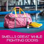 California Scents Coronado Cherry spray placed next to a pink gym duffel bag and yellow sneakers in a locker-room setting