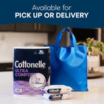 Packaged Cottonelle Ultra Comfort toilet paper rolls and two Cottonelle flushable wipe packs beside a blue reusable shopping bag.