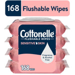 Stack of pink Cottonelle Sensitive Skin flushable wipes packs with navy label and white flip-top lid, showing 168 wipes callout.