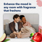 Lifestyle image of a smiling couple on a couch with headline about enhancing the mood with fragrance