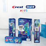 Lifestyle display of Oral‑B and Crest kids oral care products on a bathroom counter with Crest and Oral‑B Kids logos above.