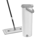 Tall cylindrical white mop bucket with gray handle and drainage spout shown with a flat mop head angled behind it