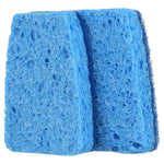 Two blue wedge-shaped non-scratch sponges shown close-up with porous foam texture visible