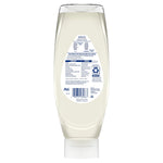 Rear label view of an upside-down clear Dawn Free & Clear bottle showing ingredients, barcode and cap