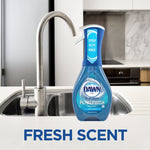 Bottle of Dawn Platinum Powerwash spray placed on a kitchen sink countertop with 'Fresh Scent' text below