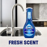 Lifestyle-style image of a Dawn Platinum Plus Powerwash spray bottle placed on a kitchen sink counter with 'FRESH SCENT' text