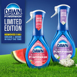 Two Dawn Powerwash spray bottles on grass, featuring summer watermelon and crisp lilac limited edition labels